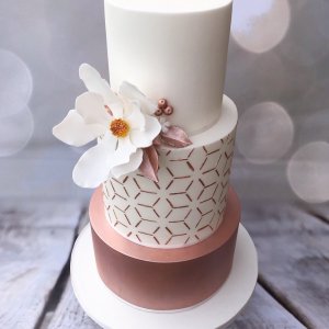Geometric cake with hand made sugar magnolia flower